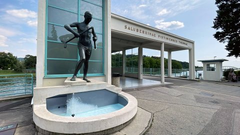 The Barlolamač statue, the symbol of Piešťany, and the spa colonnade